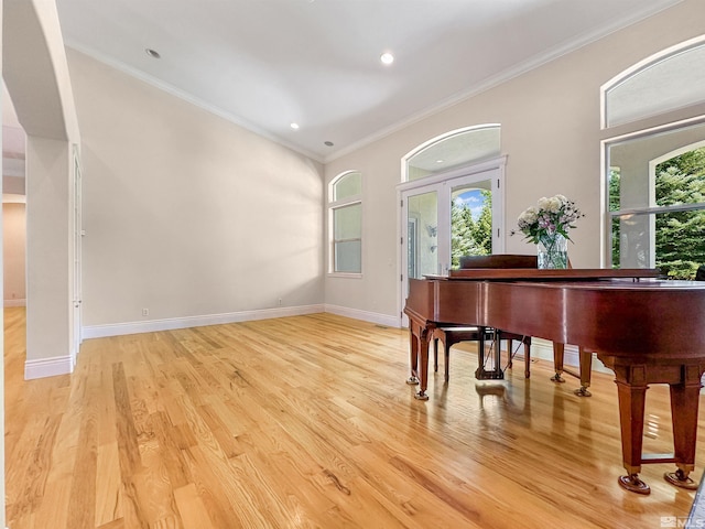 misc room featuring crown molding and light hardwood / wood-style flooring