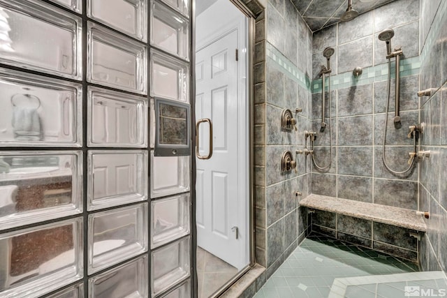 bathroom with a tile shower