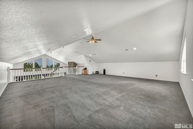 bonus room featuring carpet flooring, a textured ceiling, and ceiling fan