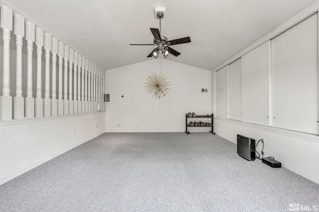 unfurnished living room featuring ceiling fan, lofted ceiling, and light carpet