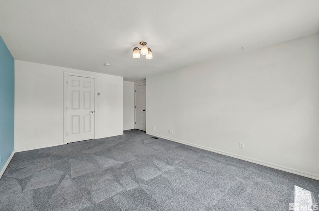 empty room featuring carpet floors