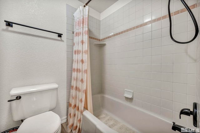 bathroom featuring toilet and shower / bath combo with shower curtain