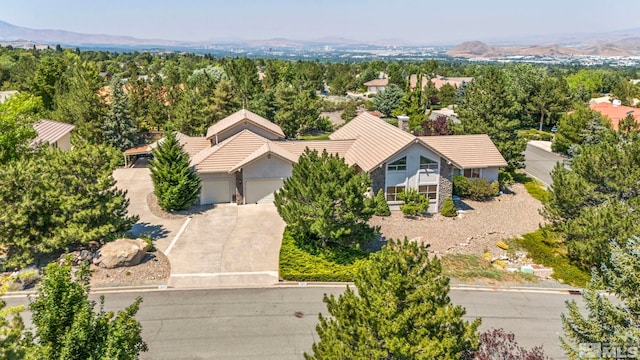 birds eye view of property featuring a mountain view