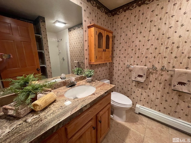 bathroom with walk in shower, toilet, vanity, tile patterned flooring, and a baseboard heating unit