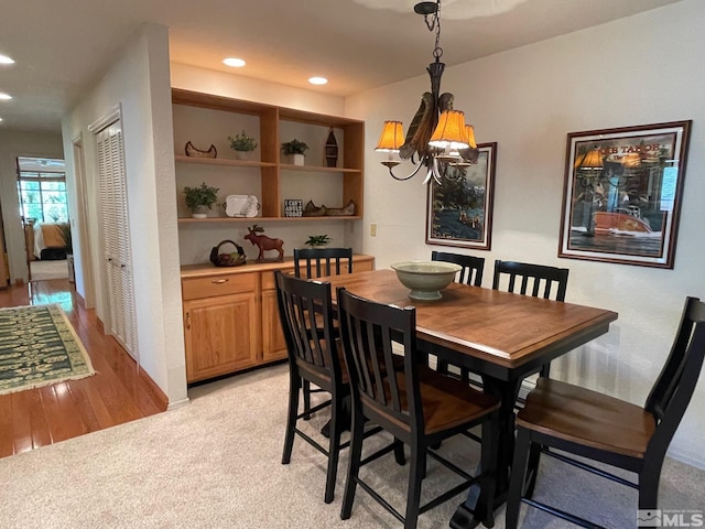 dining space with light colored carpet