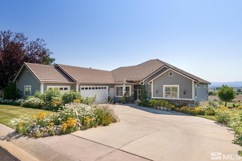 ranch-style house featuring a garage