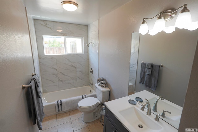 full bathroom featuring tile patterned flooring, vanity, tiled shower / bath combo, and toilet