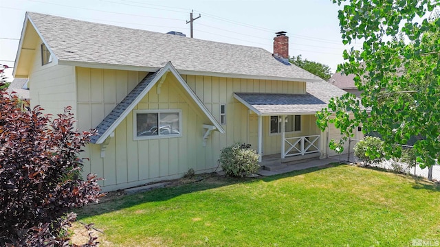 back of house with a yard