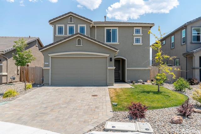 front of property with a garage and a front yard