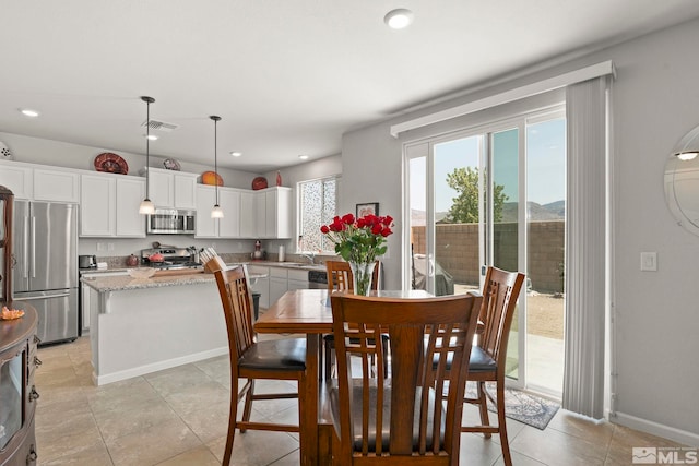 tiled dining space with sink