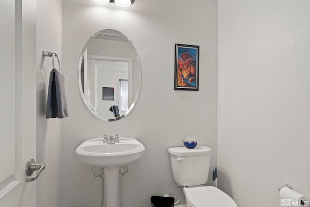 bathroom with toilet and sink