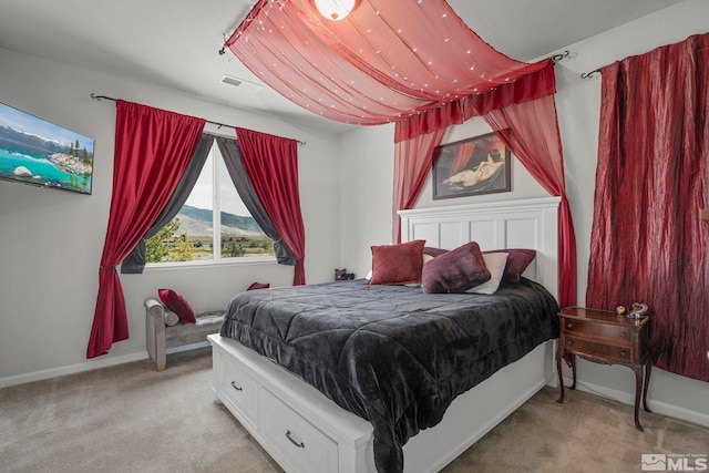 carpeted bedroom featuring a mountain view