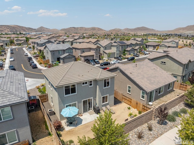 birds eye view of property with a mountain view