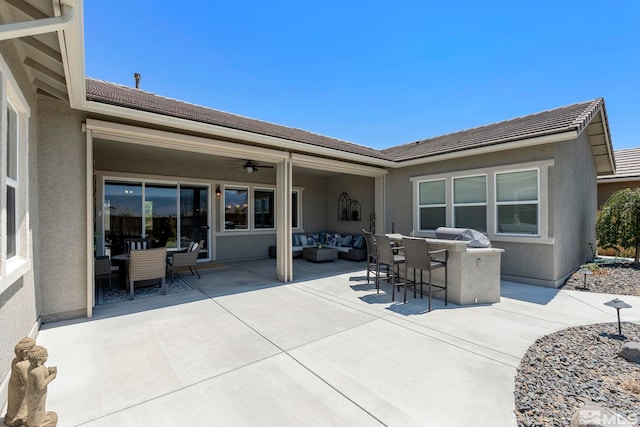 view of patio / terrace with outdoor lounge area and ceiling fan