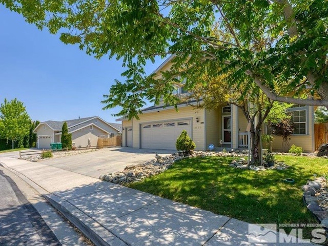 view of front of home with fence, driveway, and a front lawn