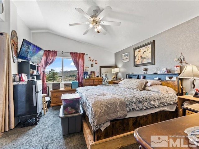 bedroom with carpet, vaulted ceiling, and a ceiling fan