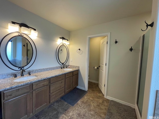 bathroom with double vanity and tile patterned flooring