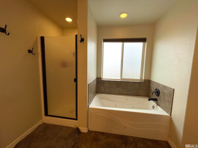 bathroom featuring separate shower and tub