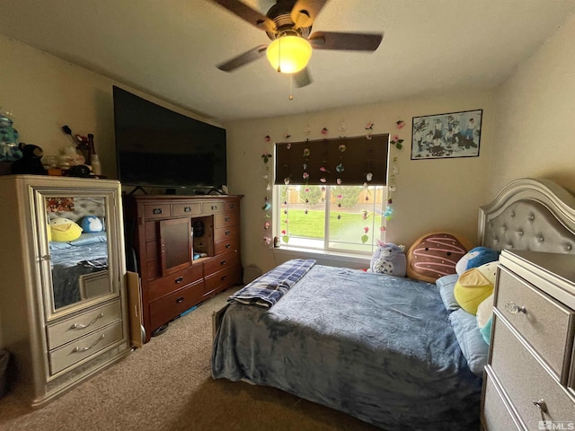 bedroom featuring light colored carpet and ceiling fan