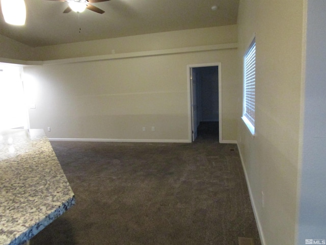 carpeted empty room with ceiling fan