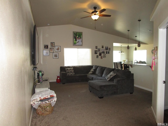 carpeted living room with vaulted ceiling and ceiling fan