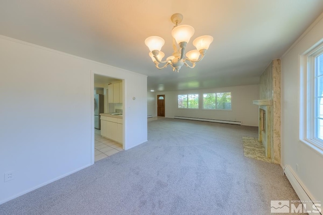 interior space with an inviting chandelier, plenty of natural light, and a baseboard radiator