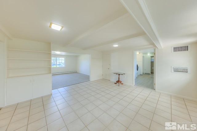 tiled spare room with baseboard heating