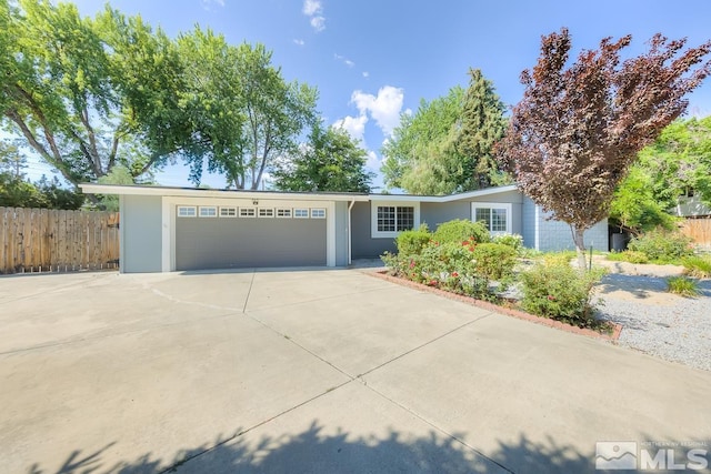 ranch-style house featuring a garage