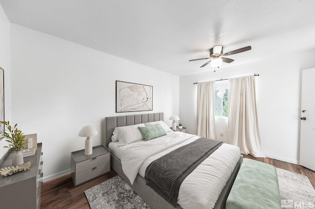 bedroom featuring ceiling fan and dark hardwood / wood-style floors