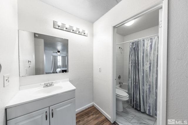 full bathroom with shower / bath combo with shower curtain, toilet, and vanity