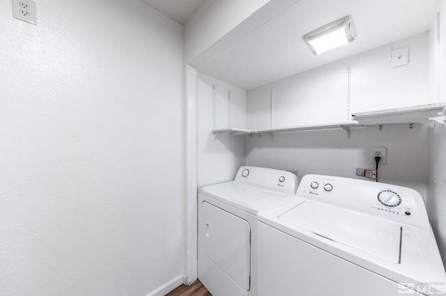 washroom featuring washer and clothes dryer and hardwood / wood-style floors