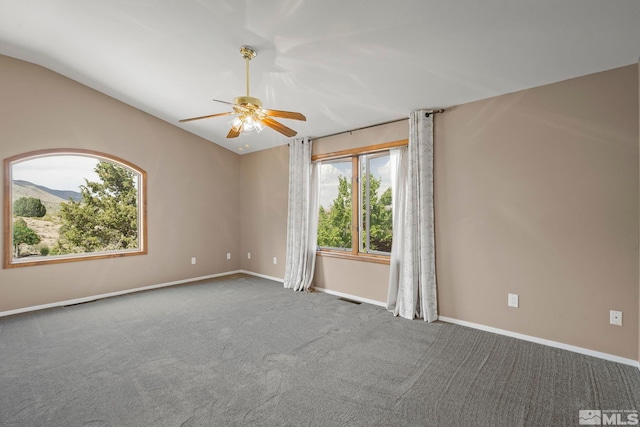 unfurnished room featuring lofted ceiling, carpet floors, and ceiling fan