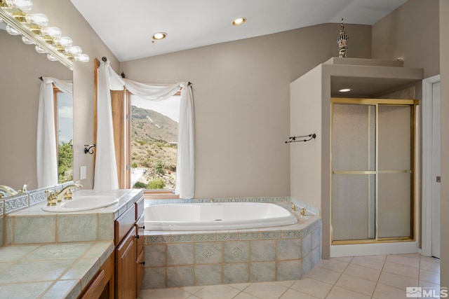 bathroom featuring tile patterned flooring, lofted ceiling, a mountain view, vanity, and shower with separate bathtub