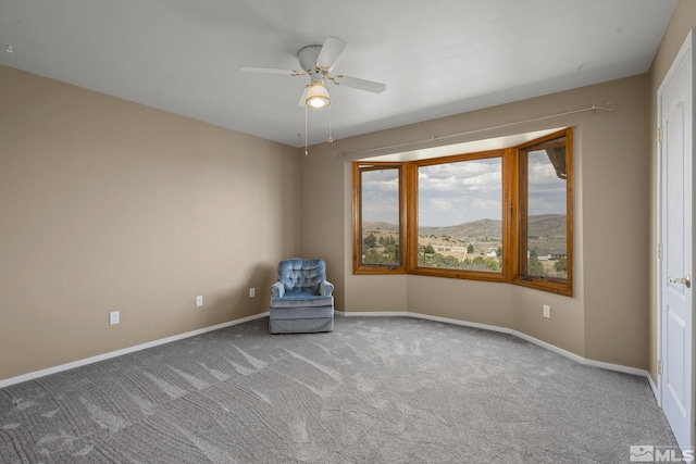 interior space featuring carpet and ceiling fan