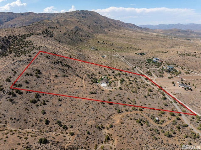 birds eye view of property with a mountain view