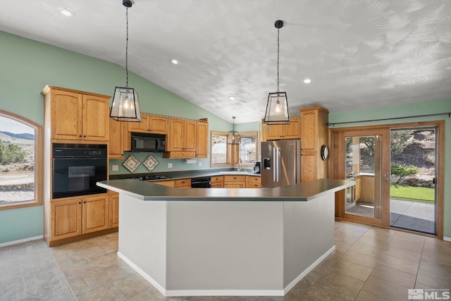 kitchen featuring decorative light fixtures, light tile patterned flooring, black appliances, a kitchen island, and lofted ceiling