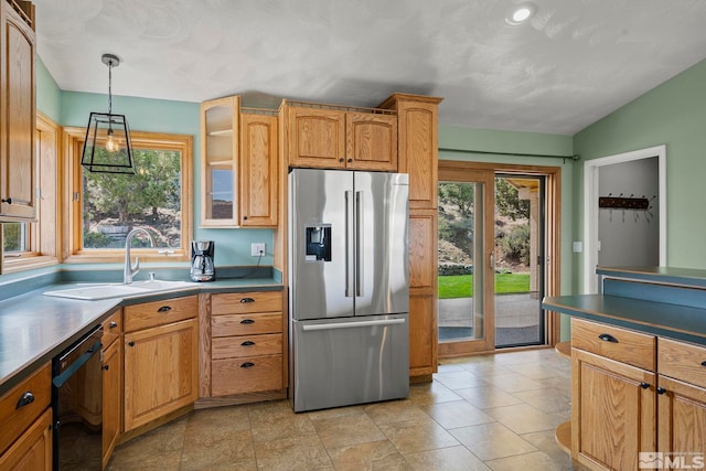 kitchen with stainless steel fridge, dishwasher, and a wealth of natural light