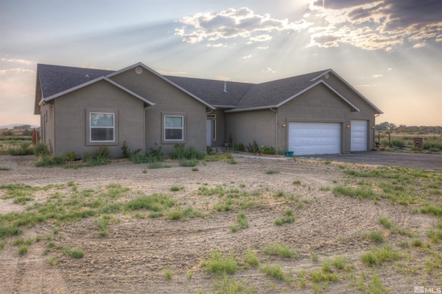 ranch-style home with a garage