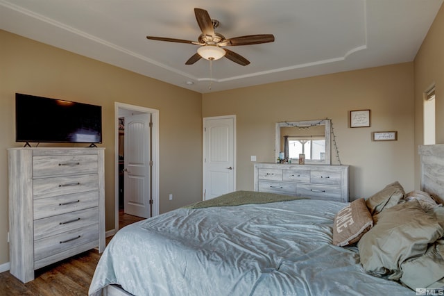 bedroom with ceiling fan and dark hardwood / wood-style flooring