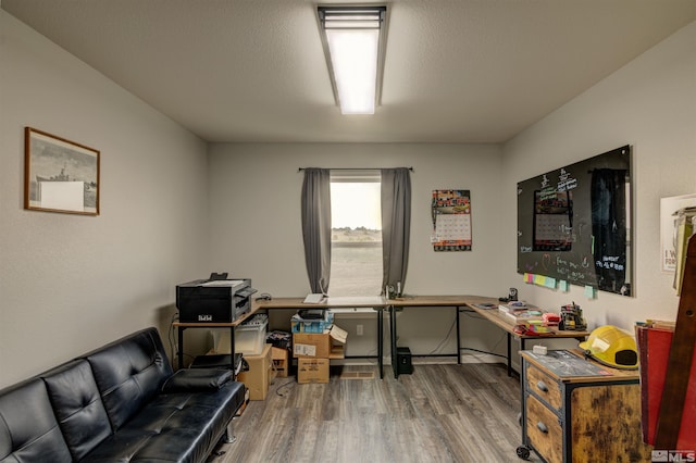 office space with hardwood / wood-style flooring and a textured ceiling