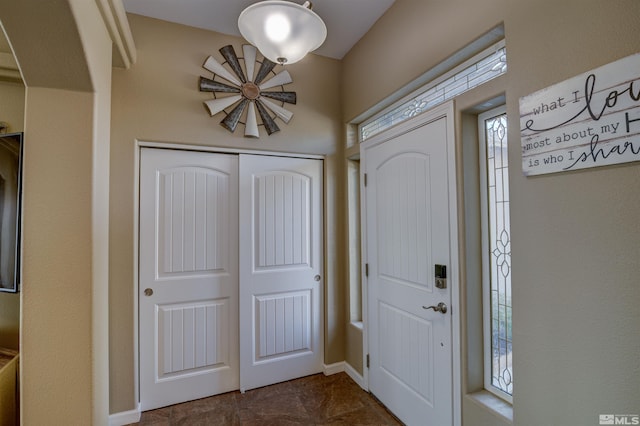 tiled foyer entrance featuring a healthy amount of sunlight