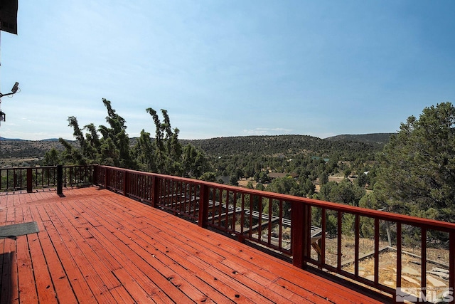 wooden terrace with a mountain view