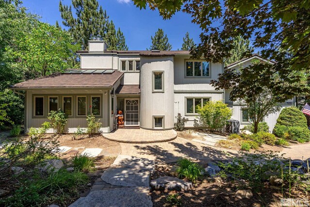 rear view of house with a patio