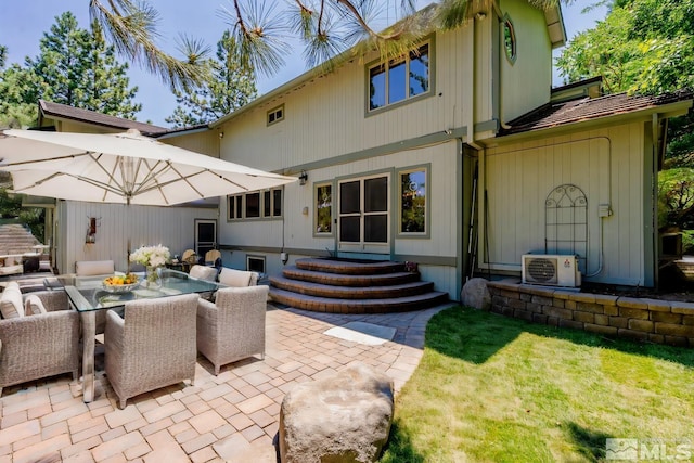 back of house featuring ac unit and a patio area