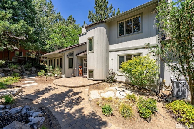 back of property featuring a patio