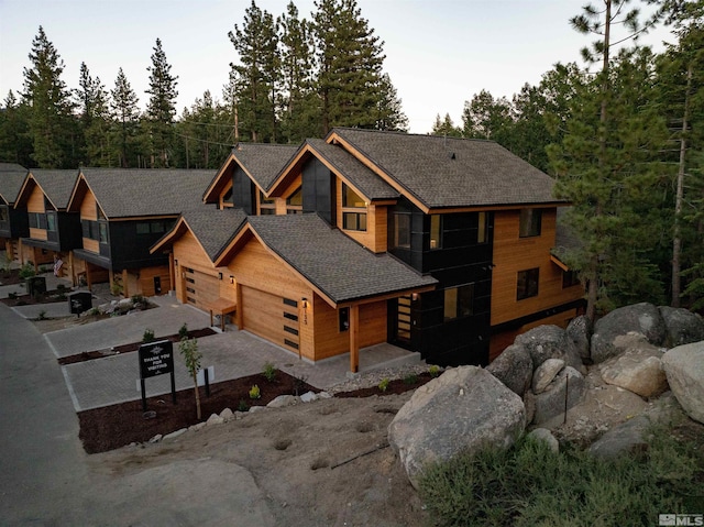 log cabin featuring a garage