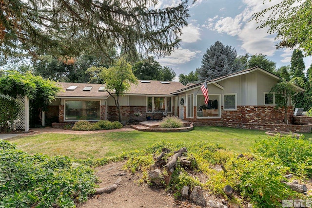 back of house featuring a lawn