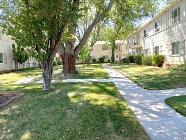 surrounding community featuring a lawn