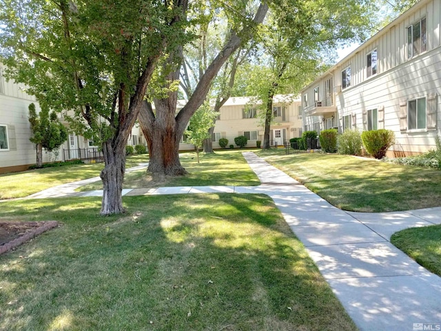 view of home's community with a lawn