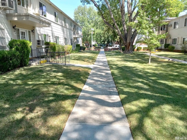 view of property's community with a lawn